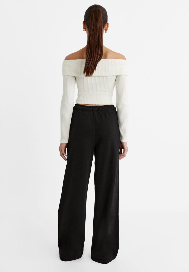 Stradivarius Stradivarius WIDE-LEG JOGGER - Tracksuit bottoms - black Großer Ausverkauf
