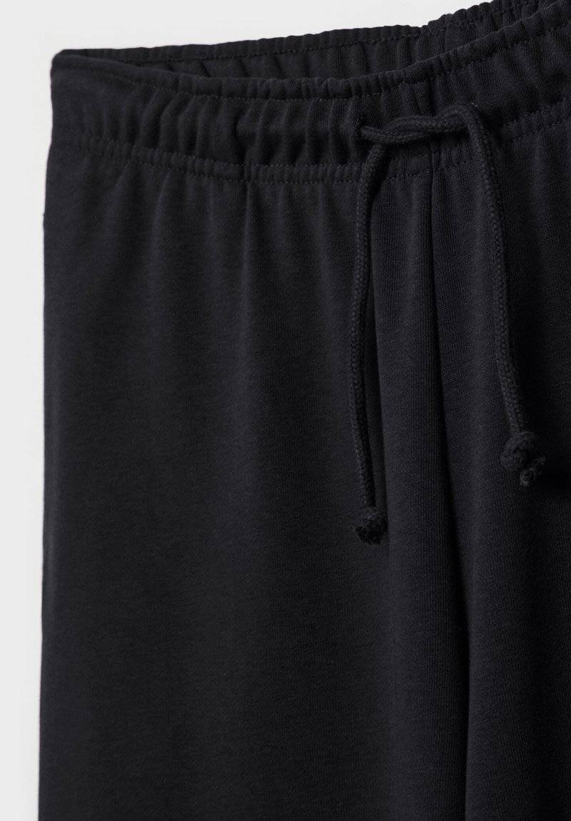 Stradivarius Stradivarius WIDE-LEG JOGGER - Tracksuit bottoms - black Großer Ausverkauf