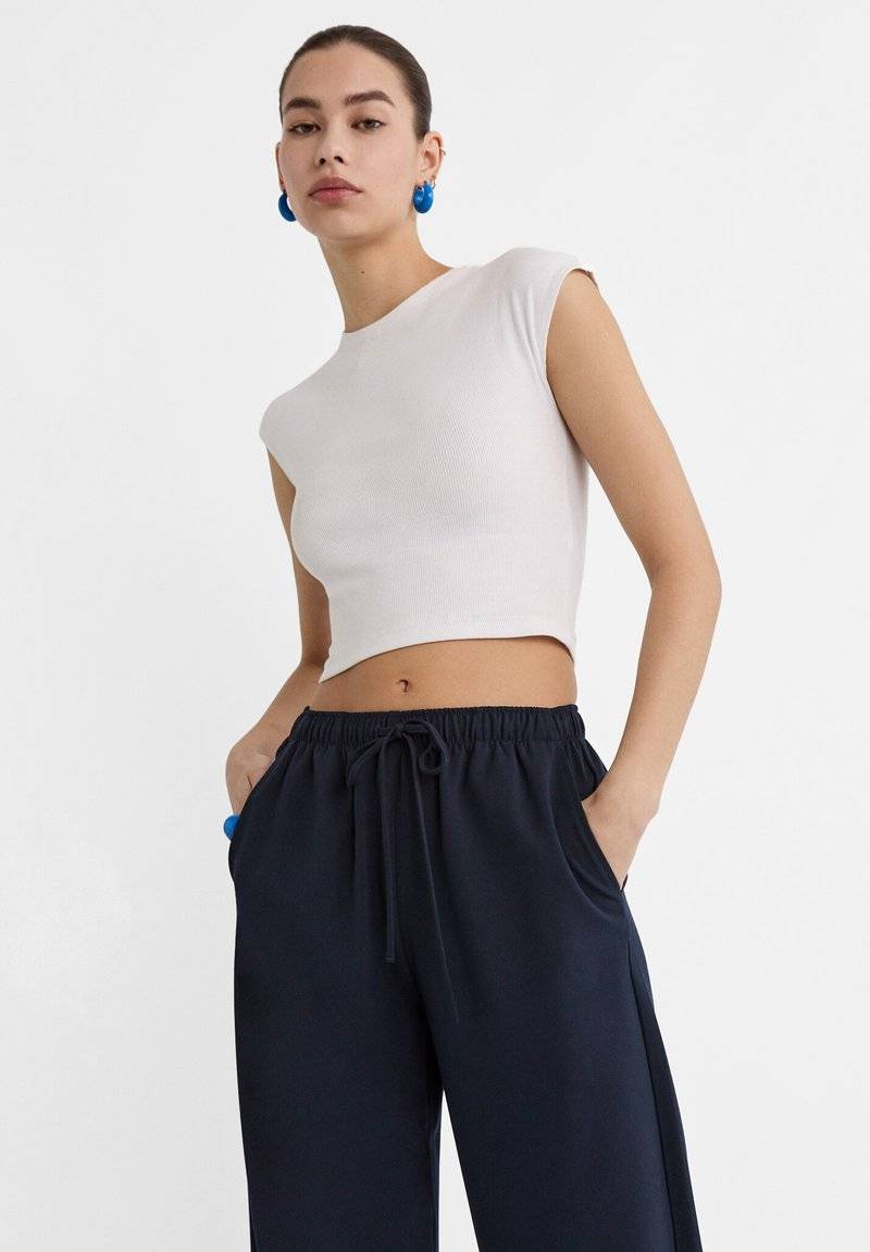 Stradivarius Stradivarius LONG FLOWING - Trousers - mottled dark blue Großer Ausverkauf