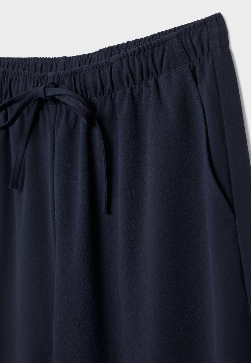 Stradivarius Stradivarius LONG FLOWING - Trousers - mottled dark blue Großer Ausverkauf