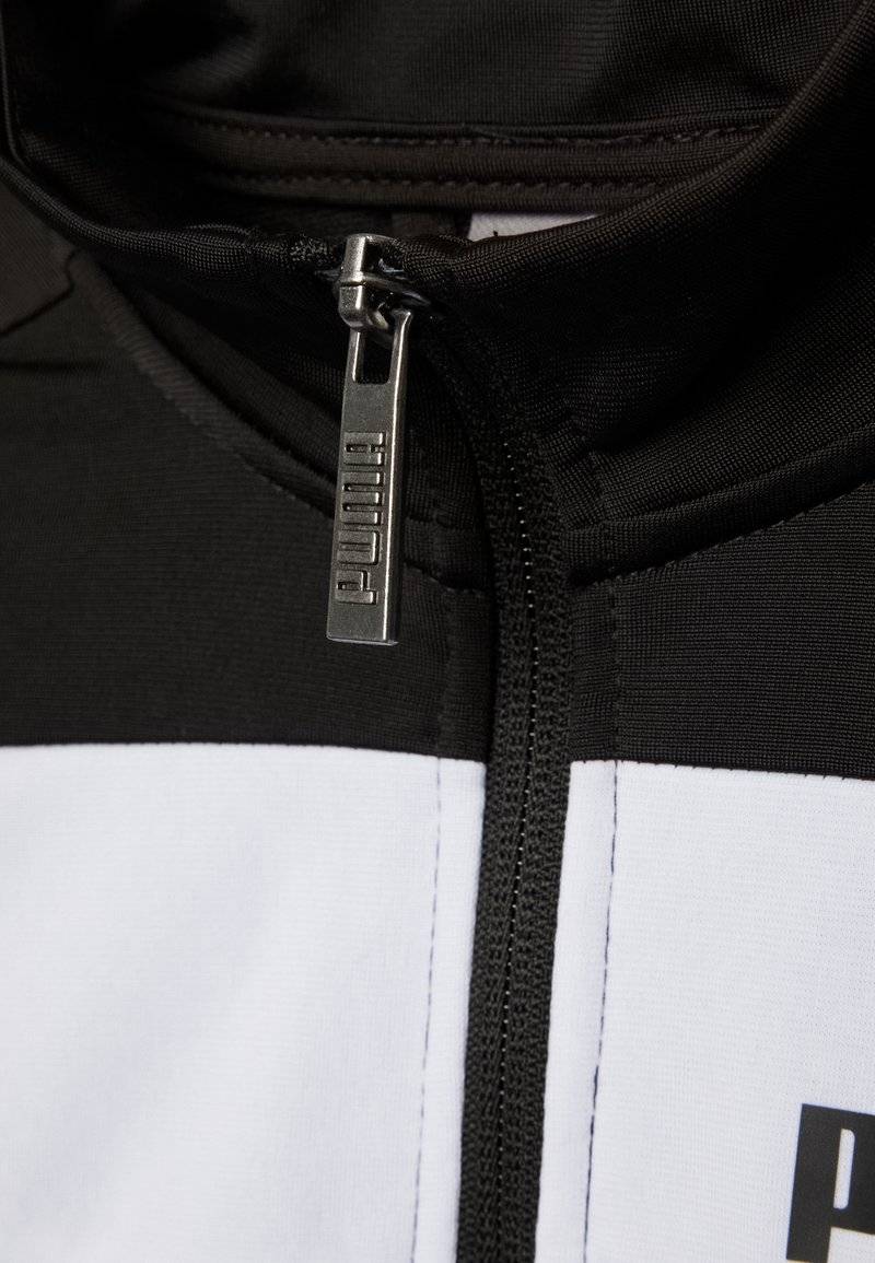 Puma Puma SUIT UNISEX SET - Tracksuit - puma black Exklusivangebot