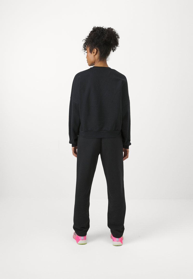 adidas Sportswear adidas Sportswear ESSENTIALS SMALL LOGO FEEL COZY OPEN HEM PANT - Tracksuit bottoms - black Outlet