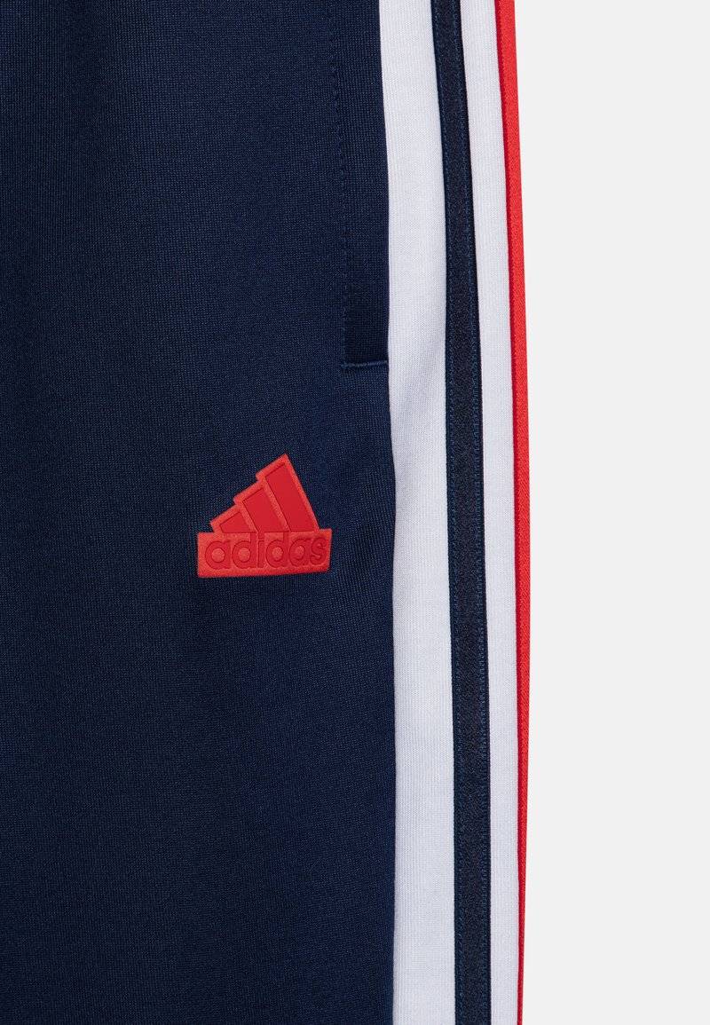 adidas Performance adidas Performance TIRO NATIONS PACK UNISEX - Tracksuit bottoms Saisonschlussverkauf