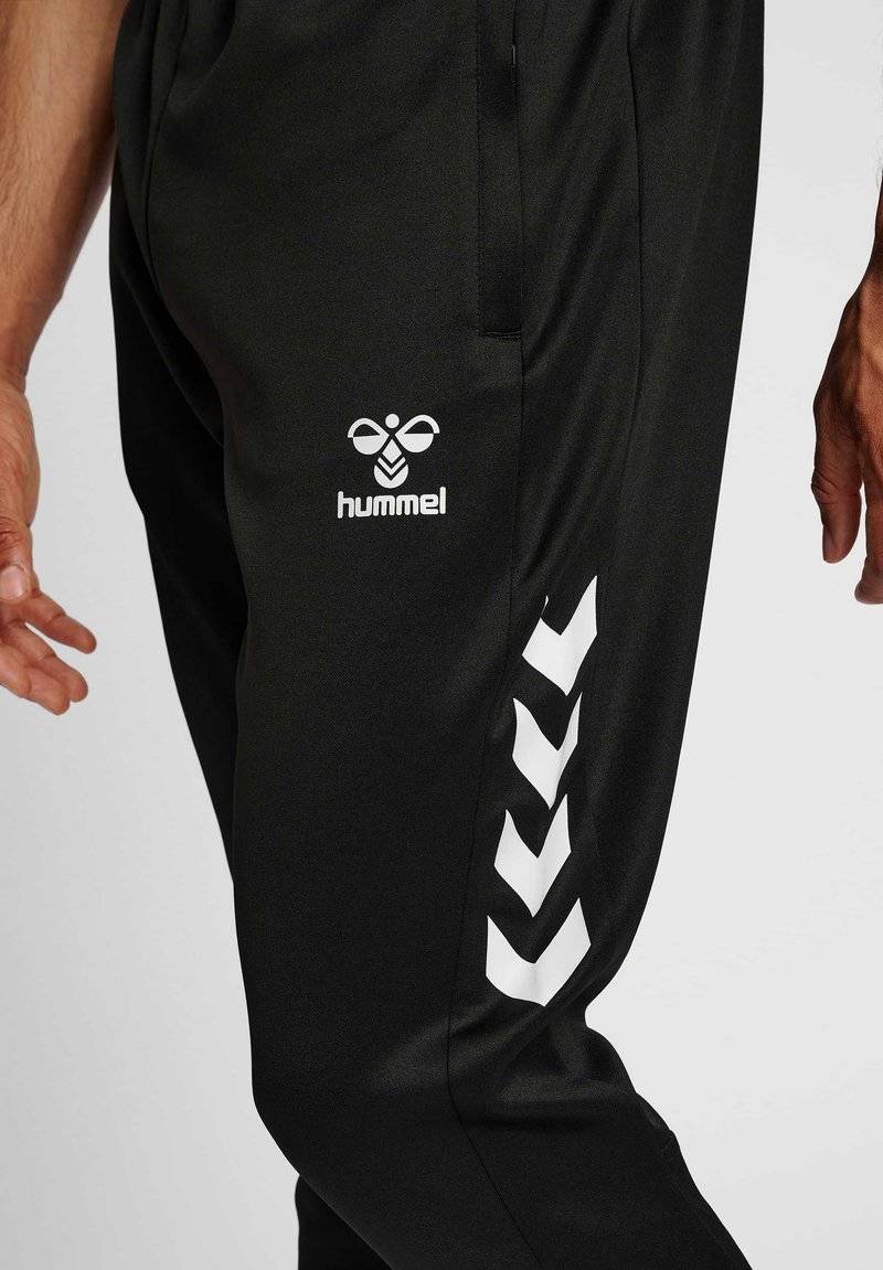 Hummel Hummel CORE XR TRAINING PANTS - Tracksuit bottoms - black Muttertagsangebot