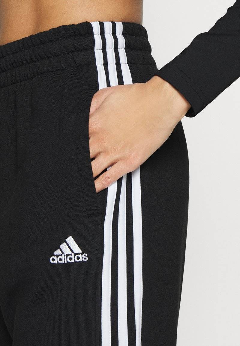 adidas Sportswear adidas Sportswear ESSENTIALS 3-STRIPES LOOSE-FIT - Tracksuit bottoms Große Rabatte