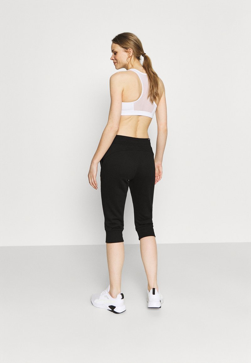Puma Puma CAPRI - 3/4 sports trousers - black Fabrik Onlineshop