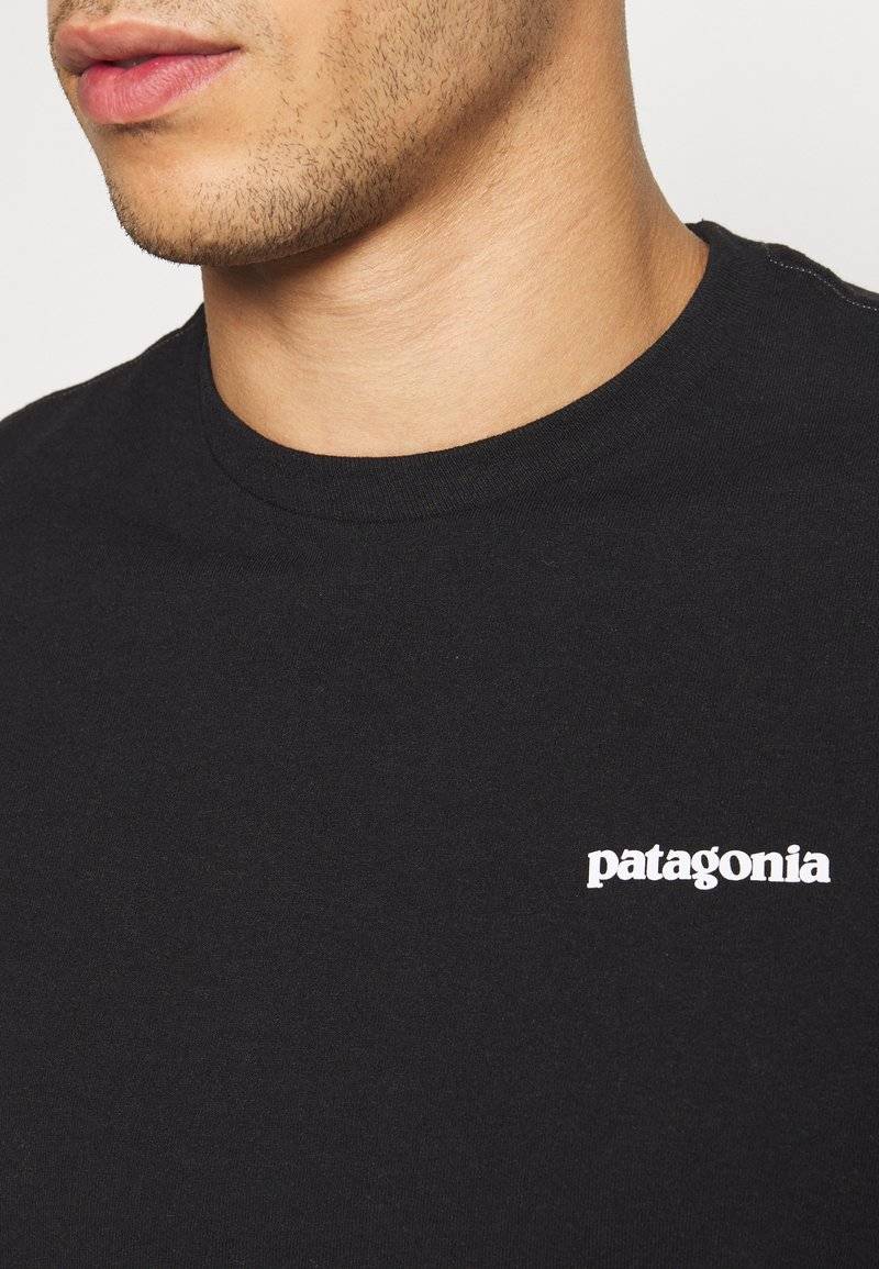 Patagonia Patagonia LOGO TEE - Print T-shirt - black Exklusivangebot