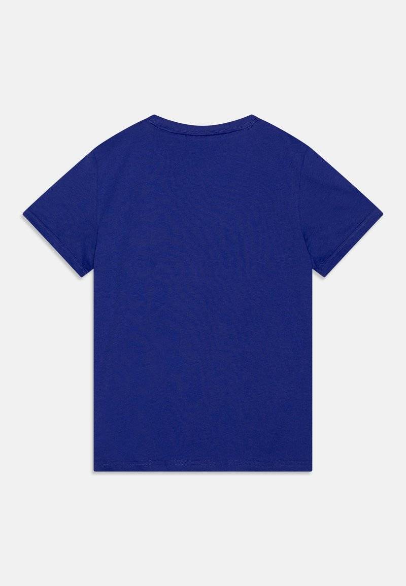 Puma Puma LOGO TEE UNISEX - Print T-shirt - lapis lazuli Räumungsverkauf