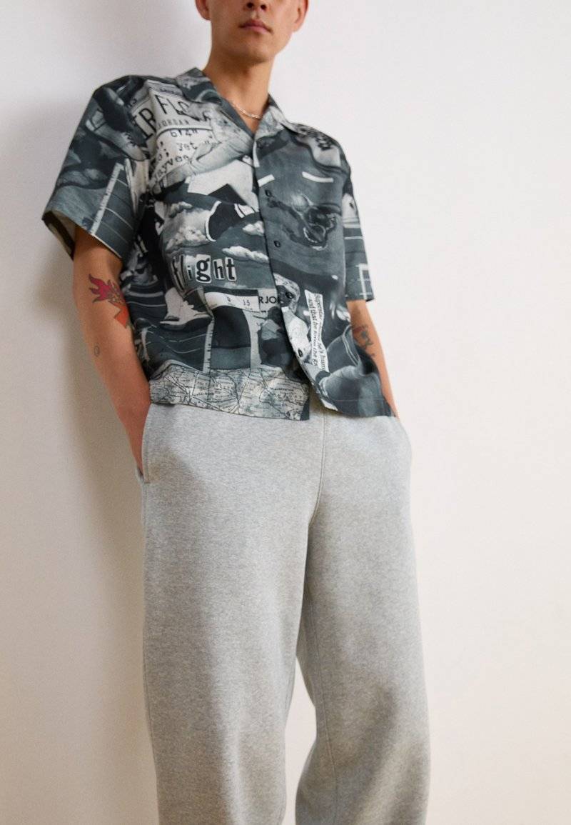Nike Sportswear Nike Sportswear BUNGIE PANT - Tracksuit bottoms - grey heather Bis zu 65% Rabatt