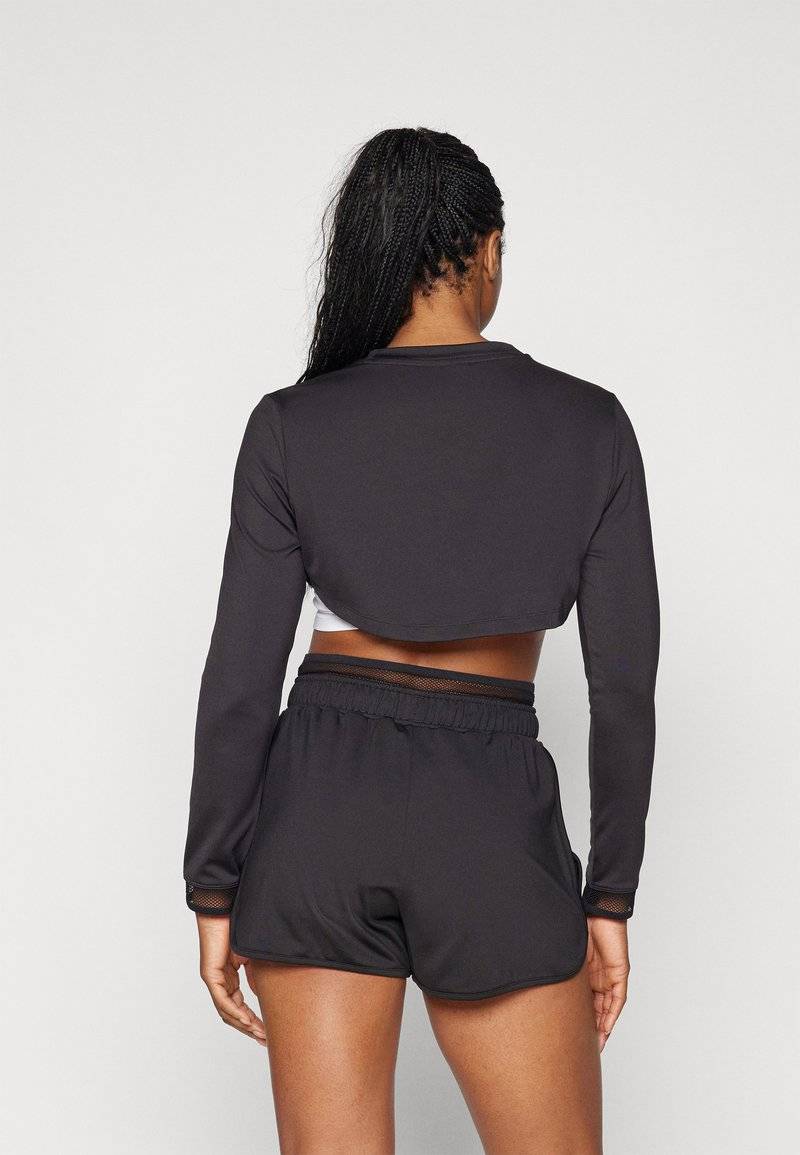 Puma Puma PAMELA REIF CROPPED - Long sleeved top - black Online Shopping