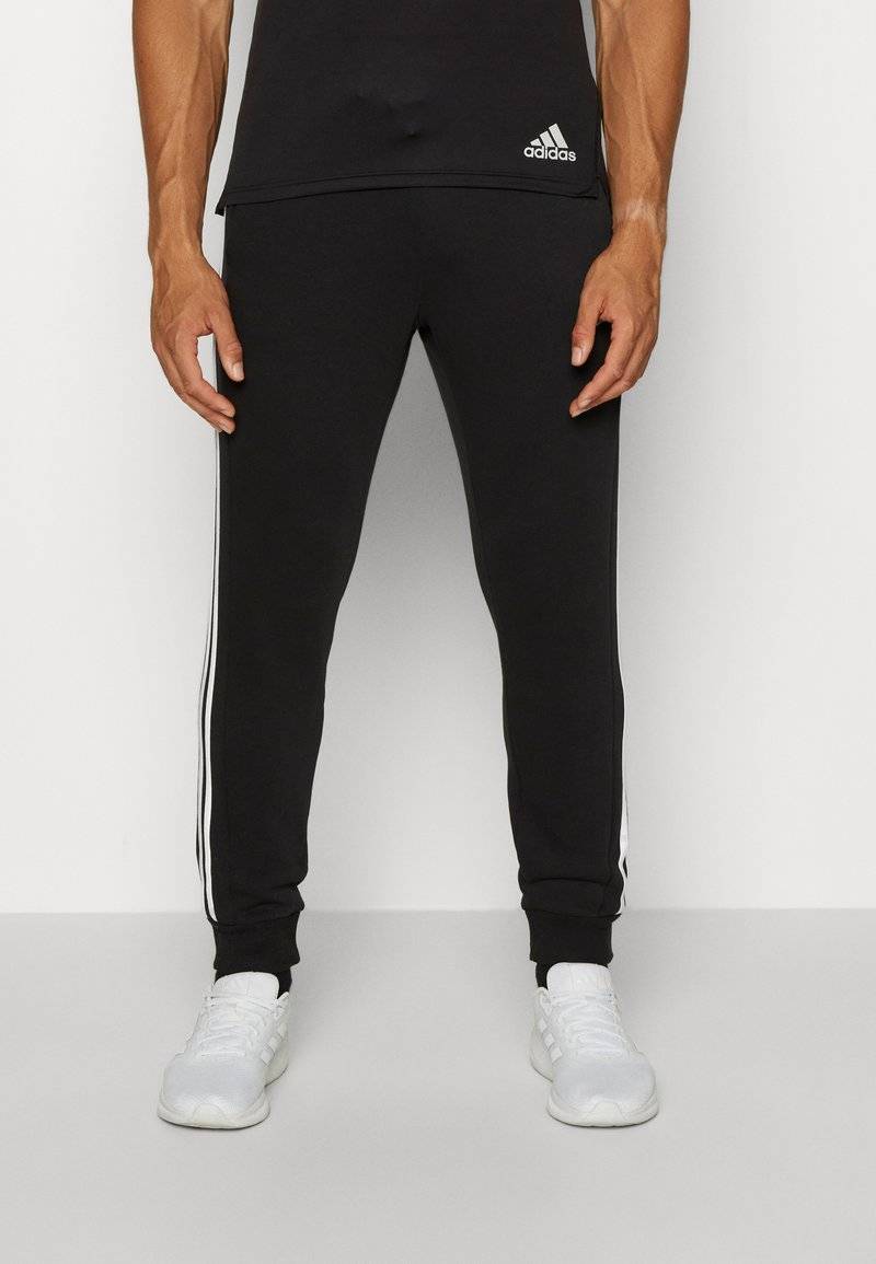 adidas Sportswear adidas Sportswear ESSENTIALS TAPERED CUFF 3 STRIPES PANTS - Tracksuit bottoms - black white Jubiläumsangebot