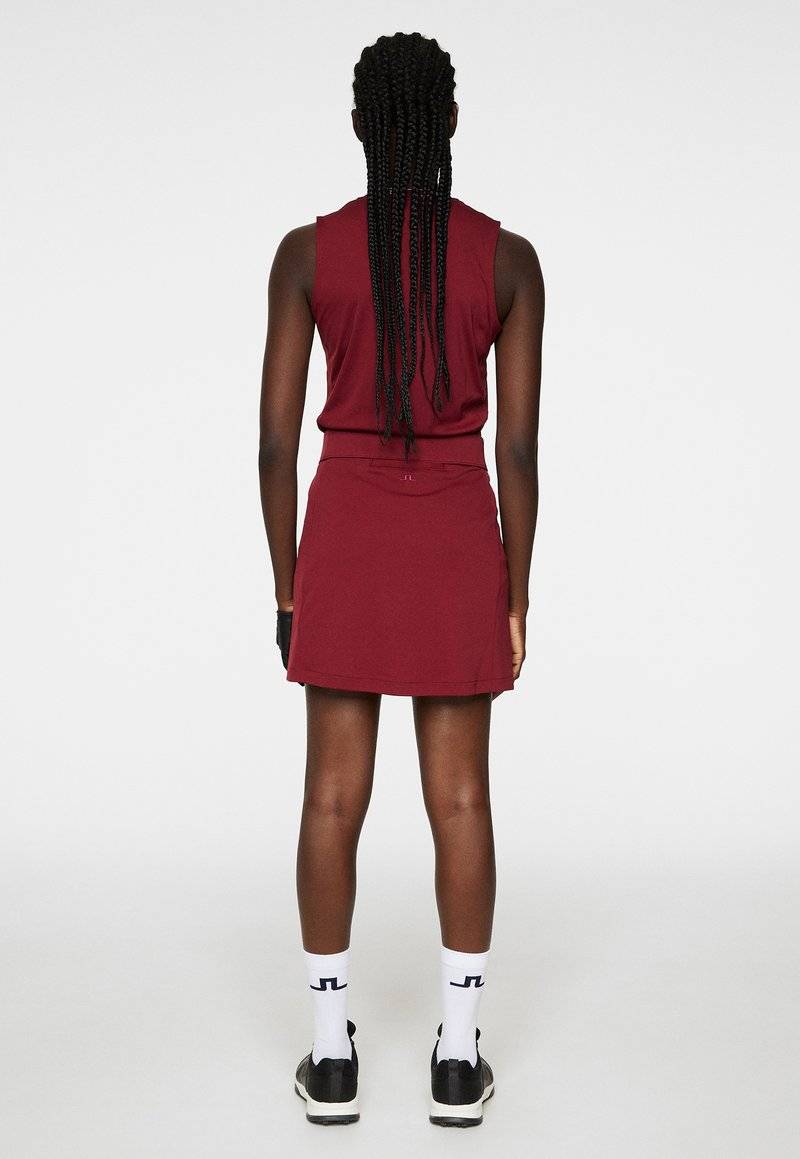 J.LINDEBERG Sports J.LINDEBERG Sports AMELIE MID - Sports skirt - cabernet Super Sparpreis