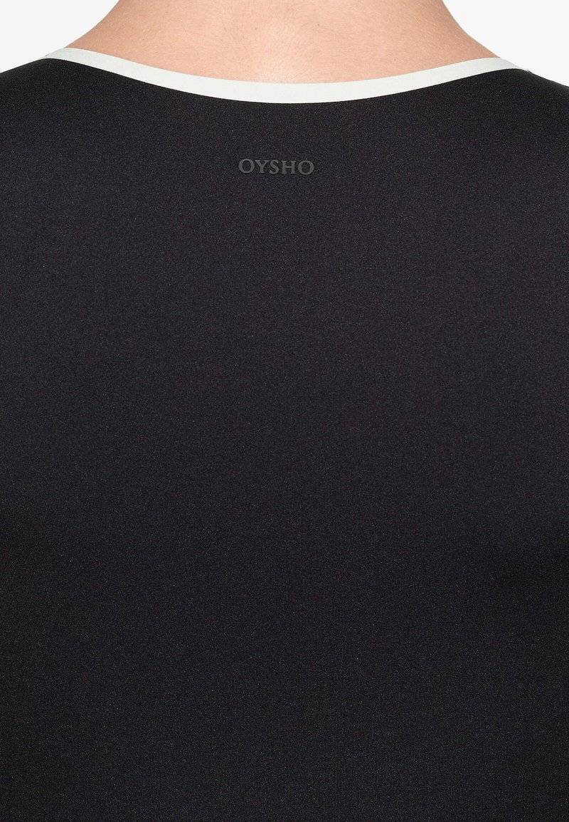 OYSHO OYSHO PERFECT-ADAPT PIPING - Sports T-shirt - black Neueste Stile