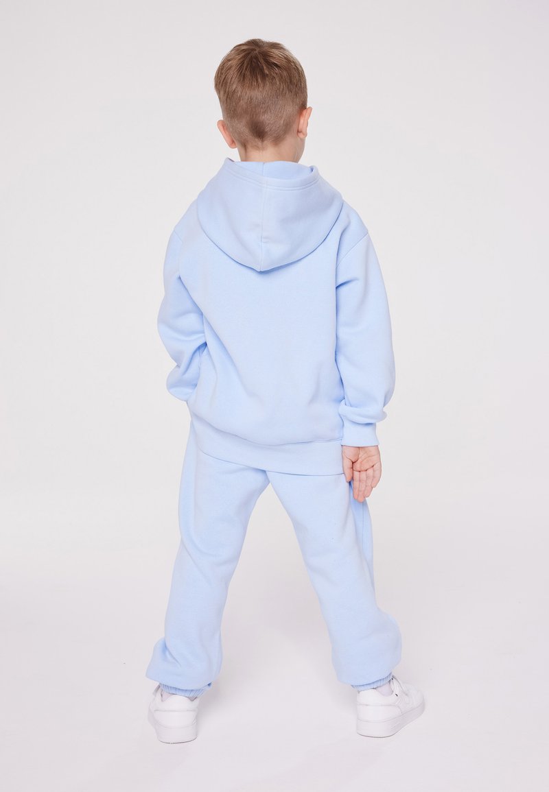 Champion Champion EXCLUSIVE PANT UNISEX - Tracksuit bottoms - light blue Letzte 2 Tage