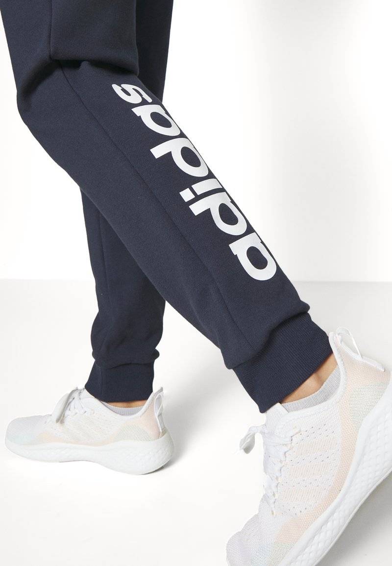 adidas Sportswear adidas Sportswear ESSENTIALS LINEAR CUFFED - Tracksuit bottoms - legend ink Black Friday Preise
