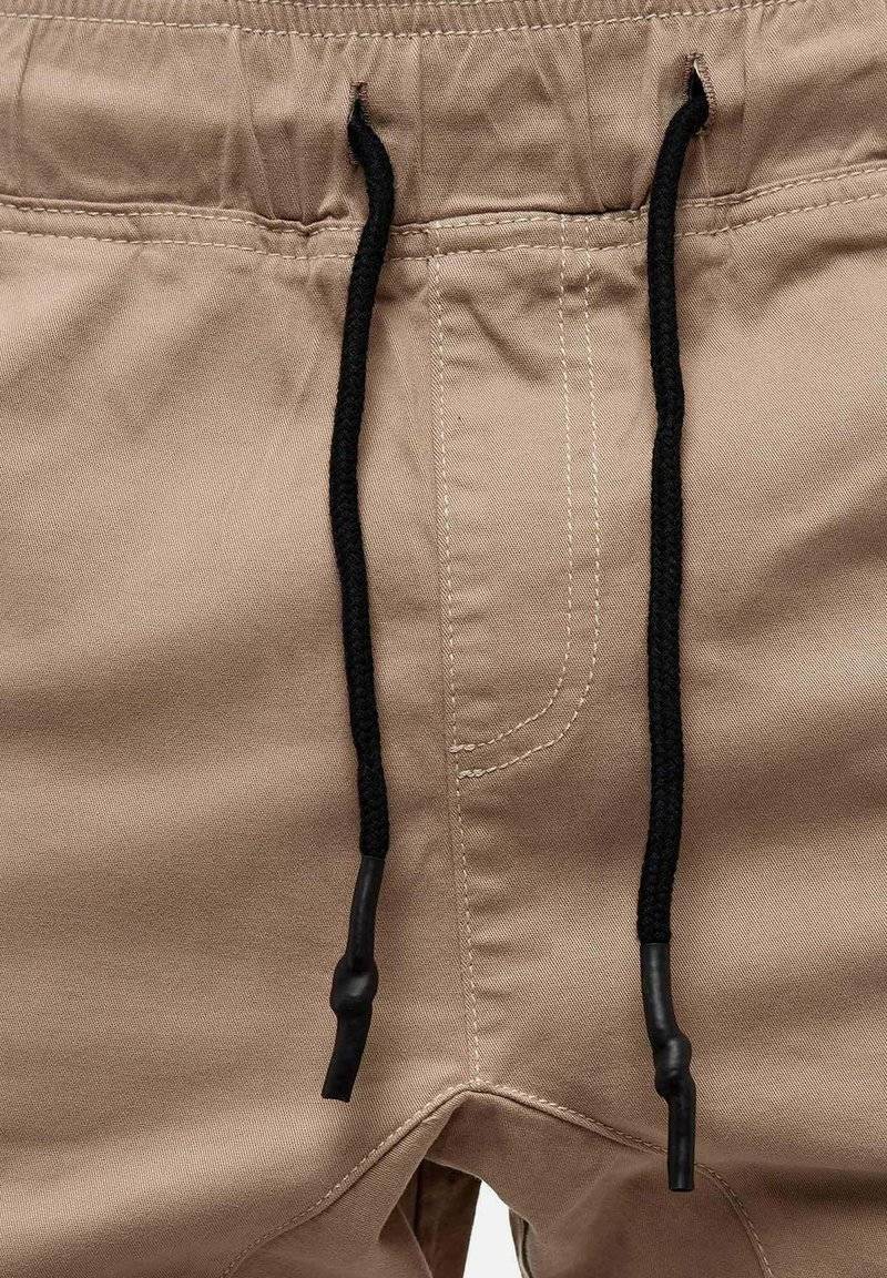 Tazzio Tazzio Cargo trousers - beige Verkauf
