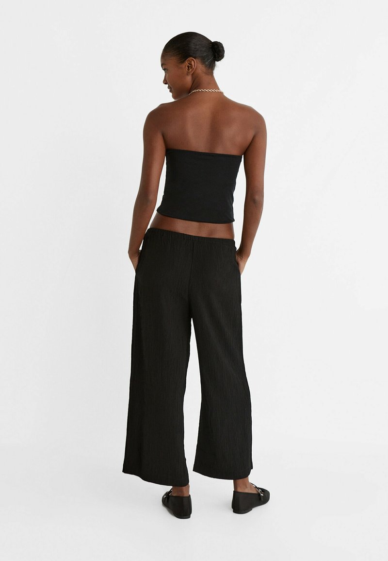 Stradivarius Stradivarius FLOWING CULOTTES - Trousers - black Online Shopping