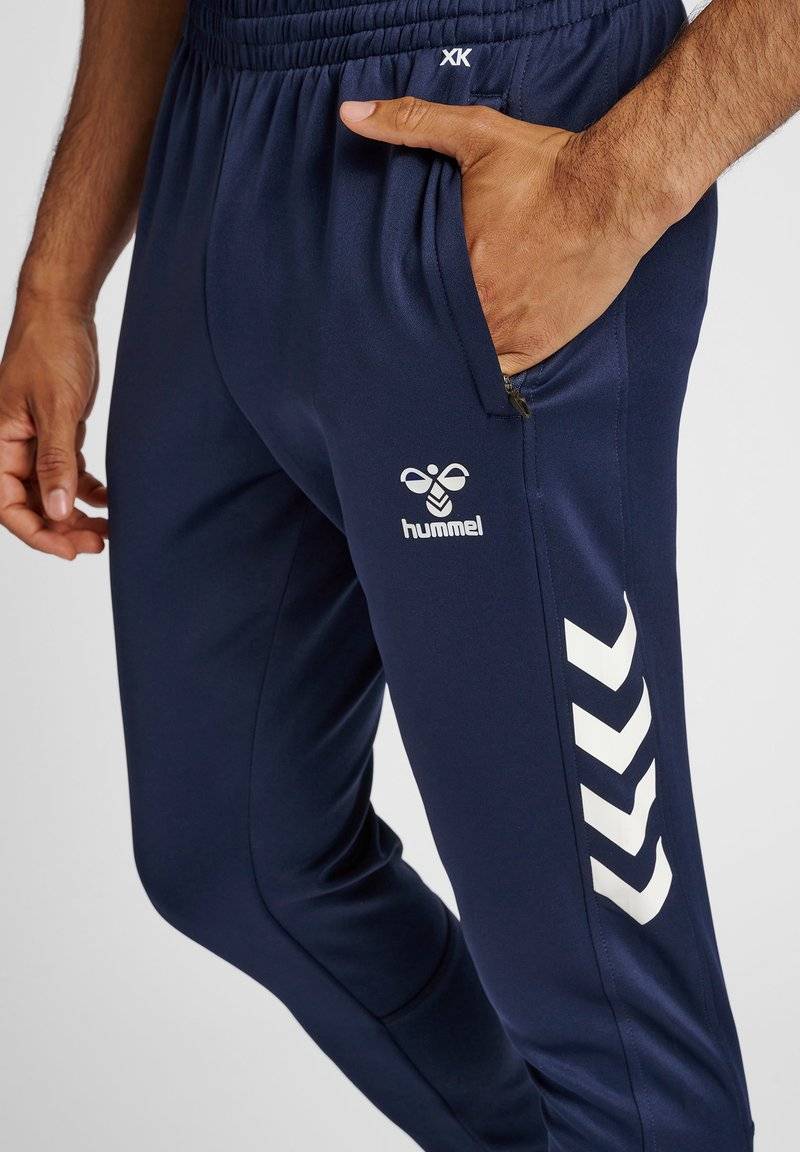 Hummel Hummel CORE XR TRAINING PANTS - Tracksuit bottoms - marine Osterangebot